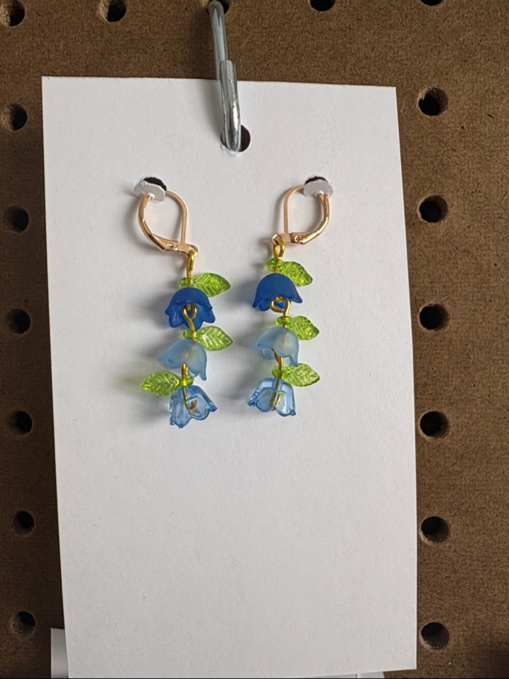 Hand Crafted Blue and Light Blue Floral Drop Earrings with Green Leaf Accents